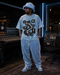 Fragments Become Whole luxury washed cotton streetwear tee modeled in a recording studio