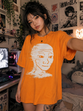 Model wearing an Orange GlitchJak luxury graphic tee with a white vintage glitch meme design