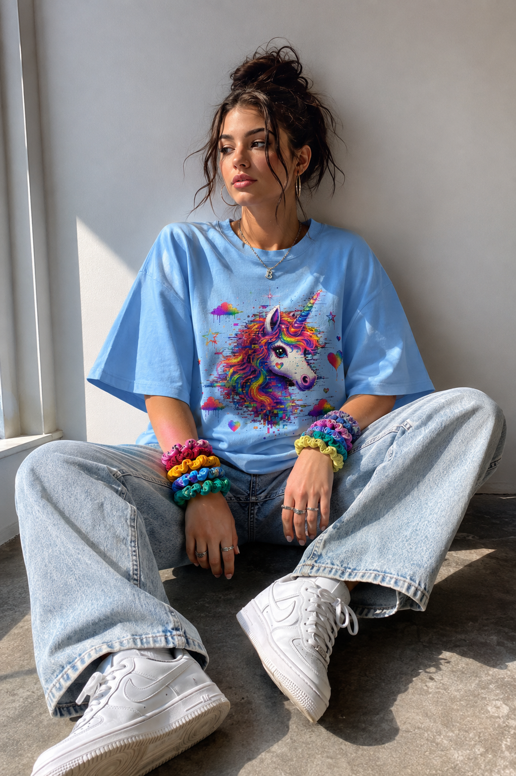 Model wearing a Sky Blue GlitchMarker unicorn graphic T-shirt in natural light