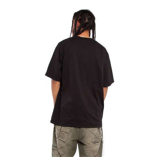 Back view of a model wearing the premium black GlitchMurica garment-dyed tee