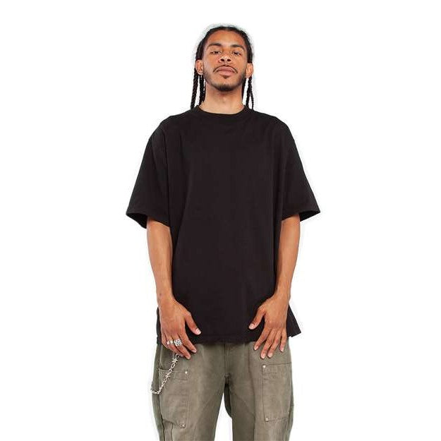 Front view of a model wearing the premium black GlitchMurica garment-dyed tee