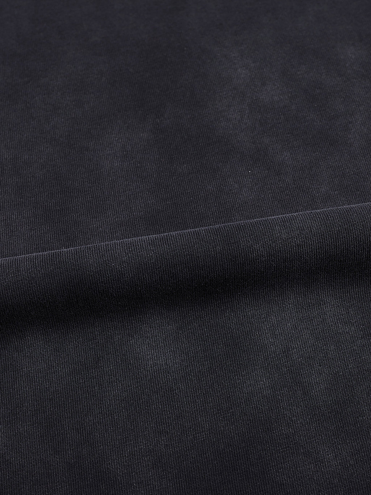 Macro detail of vintage black-gray washed 100% cotton fabric