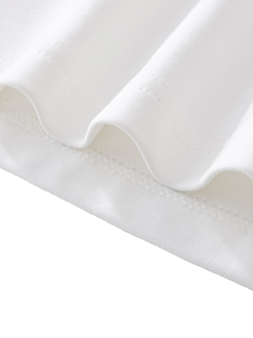 Close view of the 260 GSM cotton-spandex fabric drape and interior seam on the women's contour luxury tee